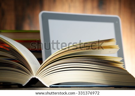 Composition with books and tablet computer.