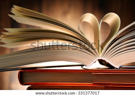 Hardcover book with two pages formed in the shape of heart.