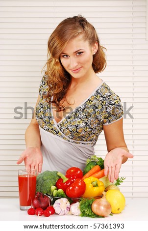 Young woman and vegetables on the table