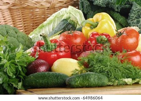 Composition with raw vegetables and wicker basket