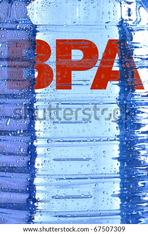 BPA sign and texture of polycarbonate plastic bottle of mineral water with drops of water