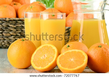 Glasses of orange juice and fruits
