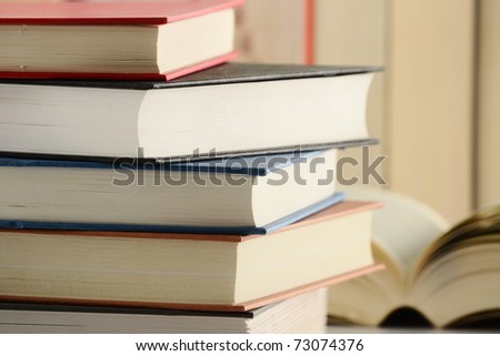 Composition with stack of books on the table