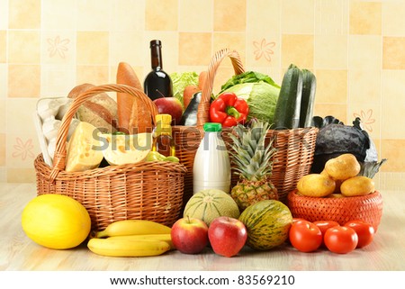 Groceries in wicker baskets on kitchen table