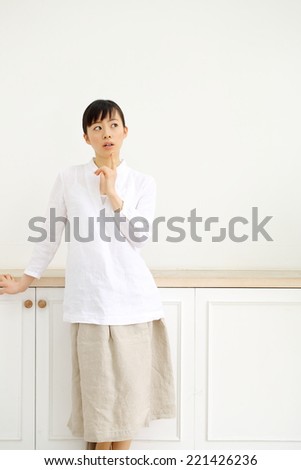 beautiful asian woman thinking in the room