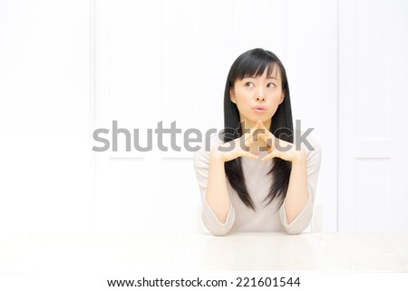 beautiful asian woman thinking