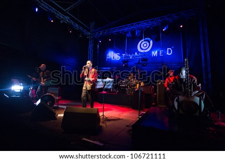 LOULE, PORTUGAL - JUNE 29: A Curva da Cintura  performs onstage in a world music festival at festival med on June 29, 2012 in Loule, Portugal.