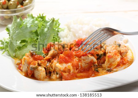 chicken white meat with tomato sauce on a plate