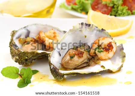 fried oysters and prawns in a shell