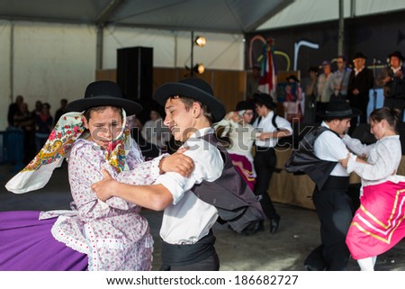 MERTOLA, PORTUGAL - MARCH 29: An unidentified children performs a Traditional Portuguese folkloric music on stage at river fish festival  MARCH 29, 2014 in Mertola, Portugal.
