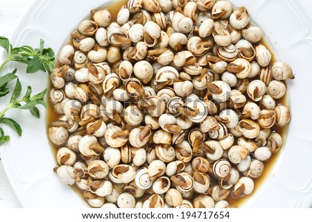 top view of cooked snails (escargot) - traditional portuguese snack