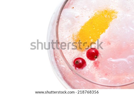 Gin hard liquor drink with gooseberries fruits isolated on white