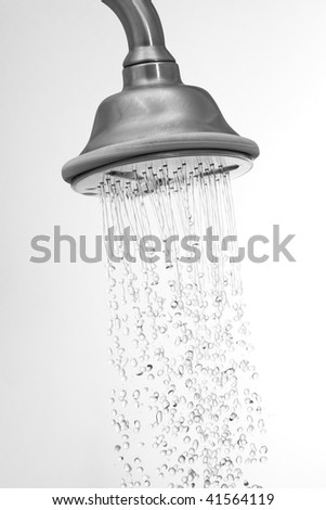 Water flowing in a old metal shower - swallow DOF.focus on top.some water drops are blurry due to water speed.