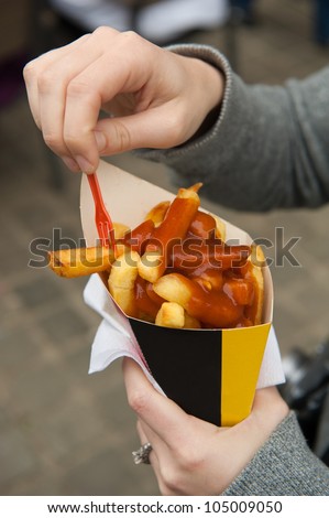 A box of french fries and curry sauce