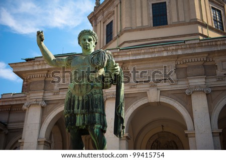 A roman statue in front of the Basilica of Saint Lawrence in Milan, Italy