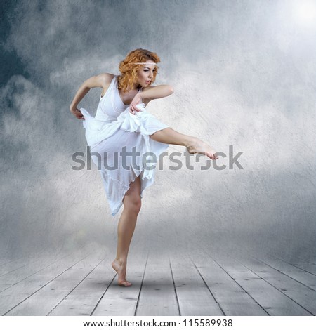 Dance element of ballerina in white dress