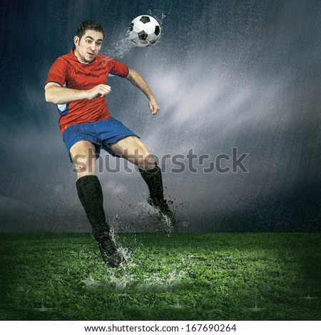Football player with ball in action under outdoors rain