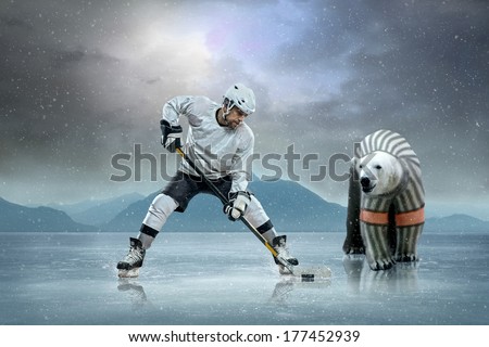 Ice hockey player on the ice and polar bear