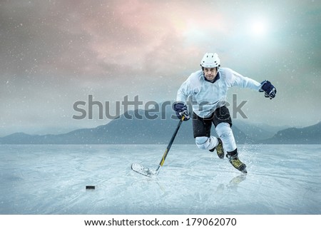 Ice hockey player on the ice, outdoor.