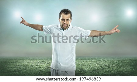 Soccer player after goal, outdoors.