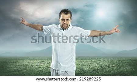 Soccer player after goal, outdoors.