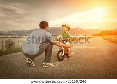 Father and son on the bicycle outdoor
