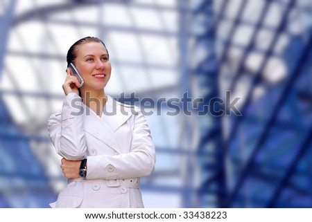 Happiness business-women call by phone on business architecture background