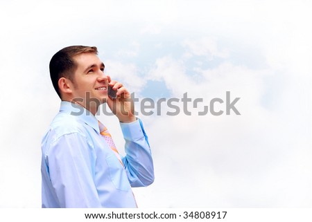 Happiness businessmen call by phone on sky with clouds background