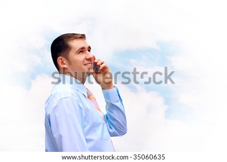 Happiness businessmen call by phone on sky with clouds background
