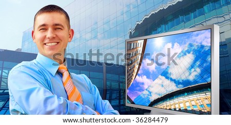 Happiness business man on business architecture background and monitor