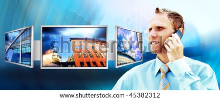 Happiness businessman in the business studio with monitors