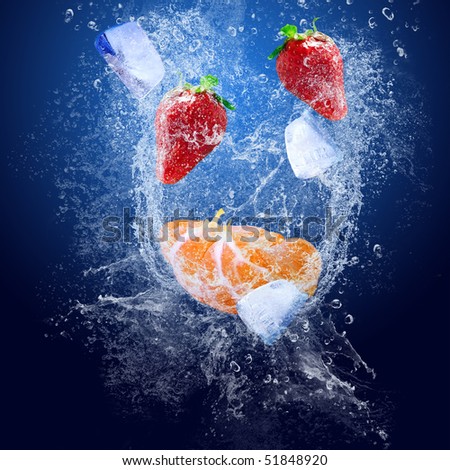 Water drops around fruits on blue background