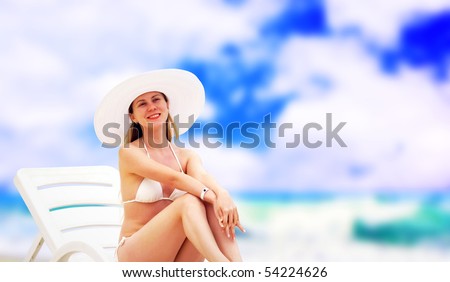 Young beautiful women on the sunny tropical beach in white bikini
