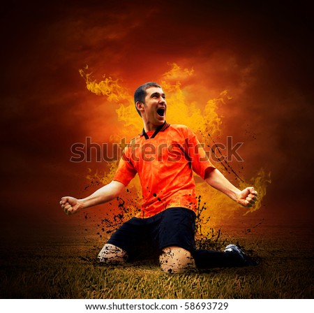 Football player in fires flame on the outdoors field
