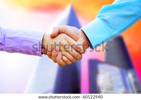 Shaking hands of two business people