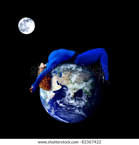 Woman in blue sleeping on the planet in space.