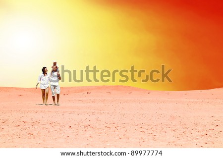 Happiness family fun in desert in sunny day