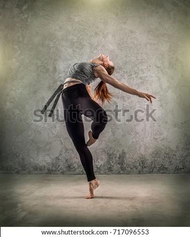 Woman dancer, in beautiful dynamic jump action figure on the grunge background.