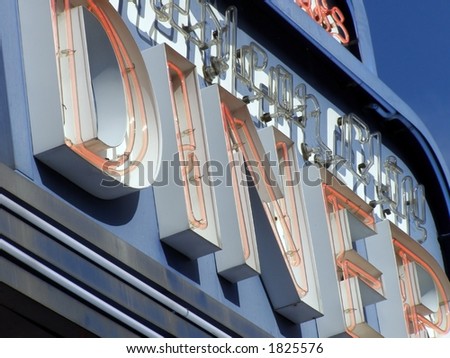 Sectional shot of neon diner sign detail.