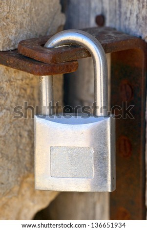 new lock closing an old wooden door