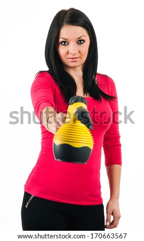 Young housewife prepares a steam cleaner to clean