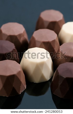 chocolate bonbons on black base