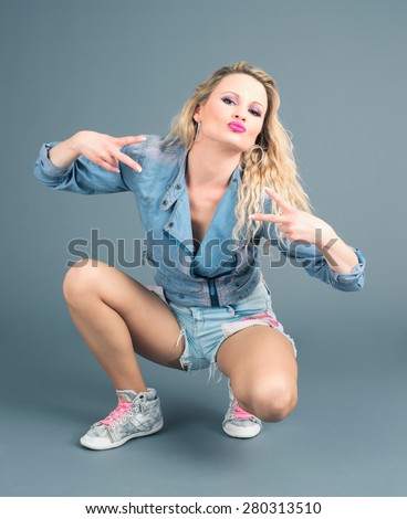 white rapper blond girl poses in studio