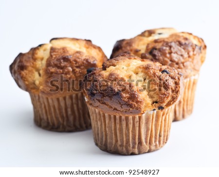 Cupcakes with hints of chocolate on white background