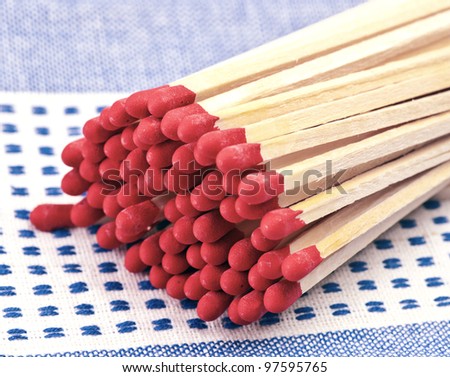 group of red-head matches on tea towel