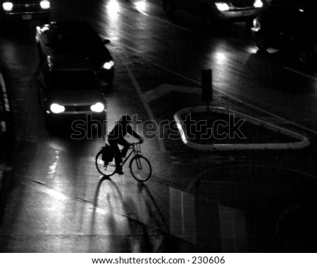Picture of a bike commuter riding home at night.