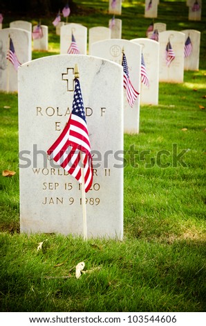 MARIETTA, GA - MAY 26: U.S. flags decorate veterans\' graves on May 26, 2012, for Memorial Day at the National Cemetery in Marietta, Ga. More than 17,500 war veterans are buried at the cemetery.