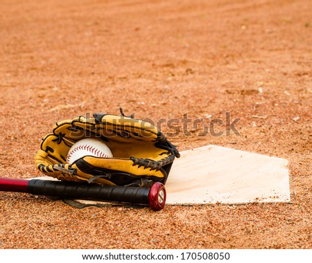 Baseball, Bat and glove close up near home plate with room for copy
