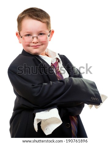 Serious child wearing suit that is too big for him
