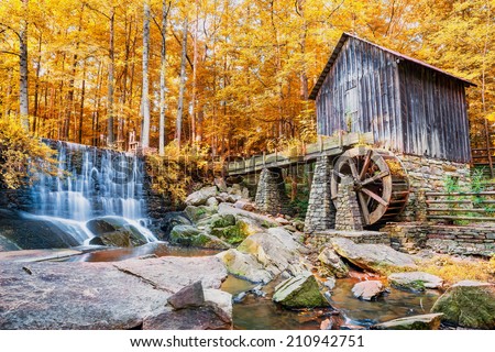 Fall or Autumn image of historic mill and waterfall in Marietta, GA